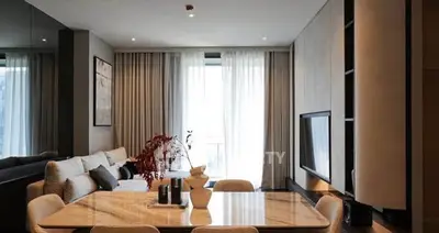 Elegant modern living room with stylish dining area and natural light