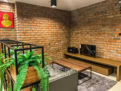 Stylish living room with exposed brick wall and modern furniture