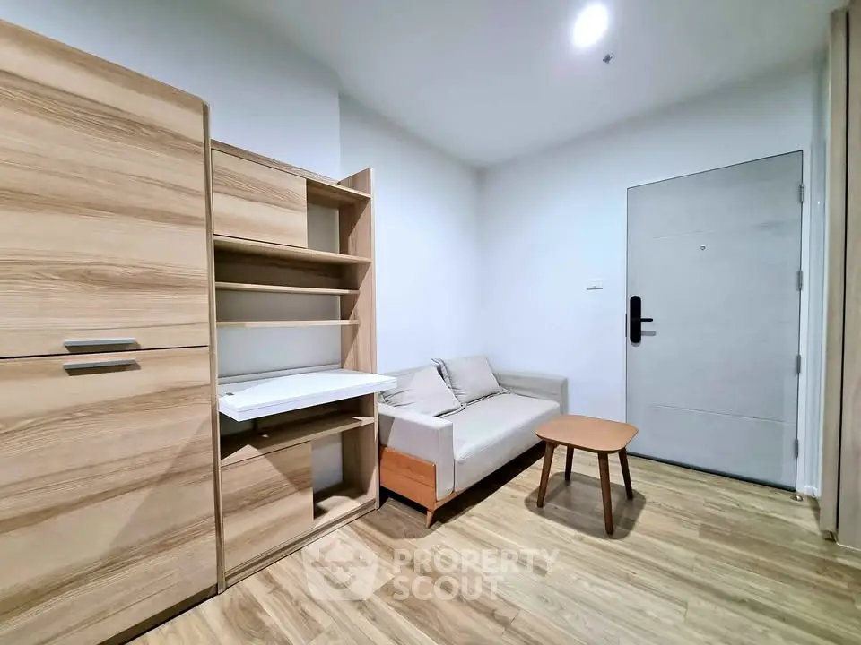 Modern minimalist living room with wooden flooring and sleek furniture