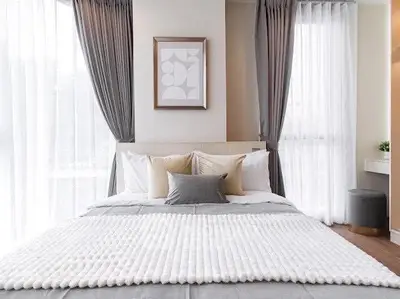 Elegant bedroom with modern decor and natural light