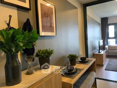 Modern living room with stylish decor and open layout, featuring cozy seating and elegant dining area.