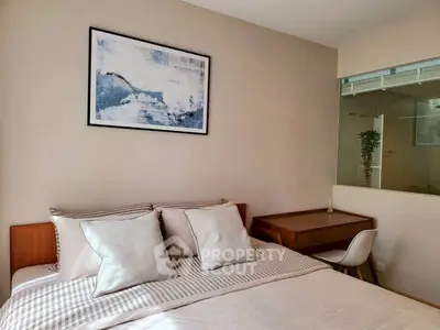 Cozy bedroom with modern decor and study area, perfect for relaxation and productivity.