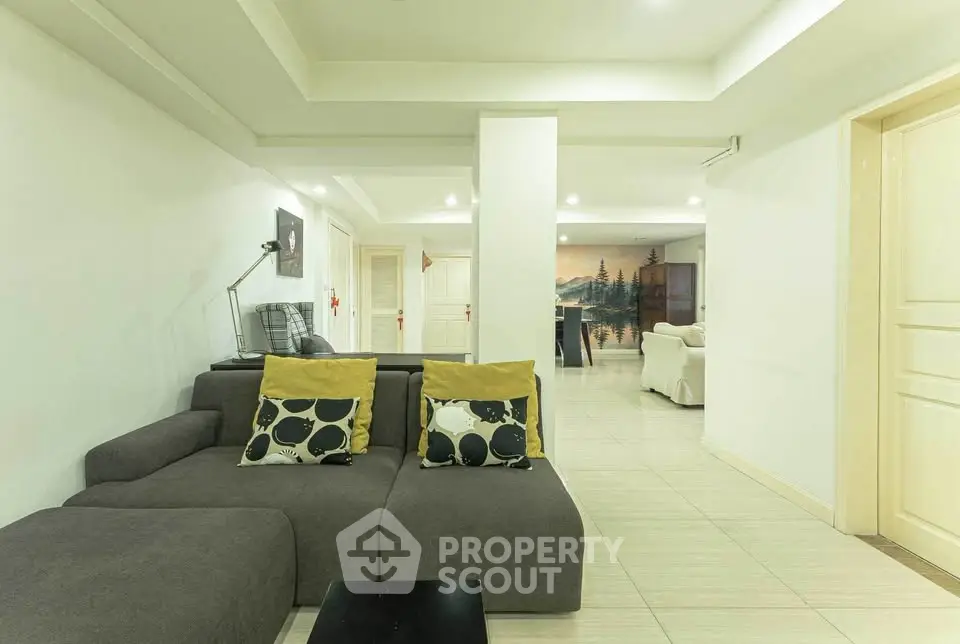 Spacious modern living room with stylish decor and comfortable seating in a contemporary home.