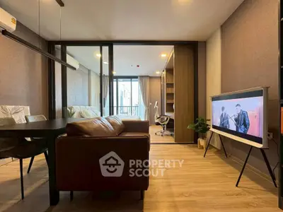 Modern living room with stylish decor and open view to study area