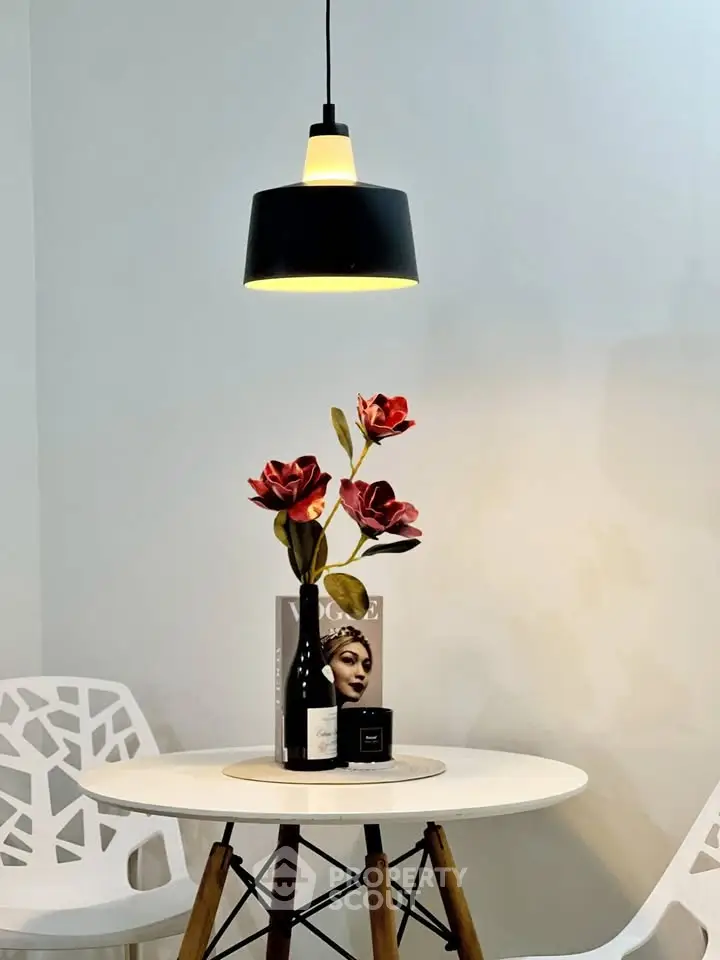 Chic modern dining area with stylish pendant light and elegant decor
