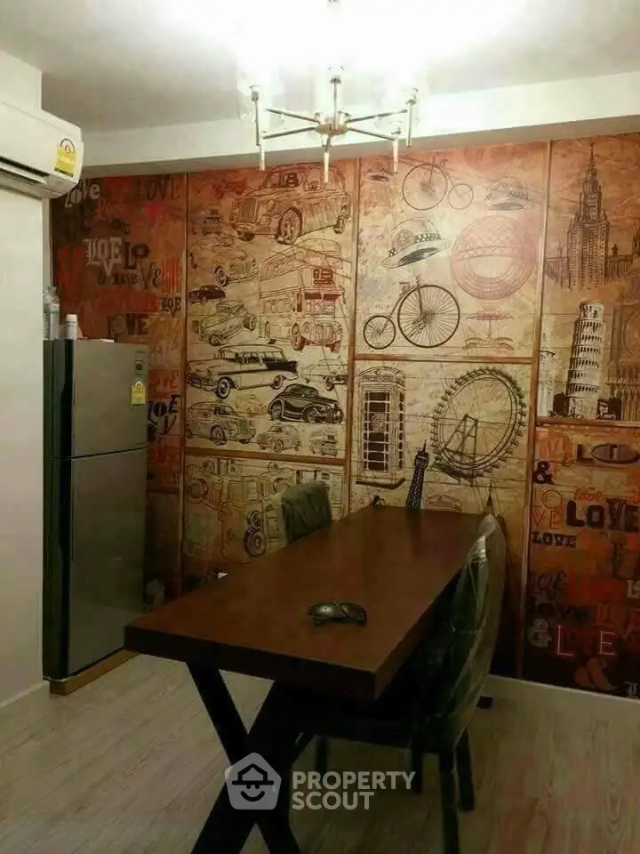 Stylish dining area with vintage-themed wall art and modern furniture, perfect for urban living.