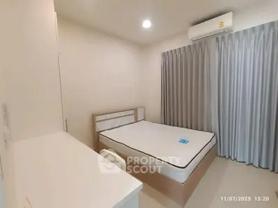 Modern bedroom with air conditioning and minimalist design