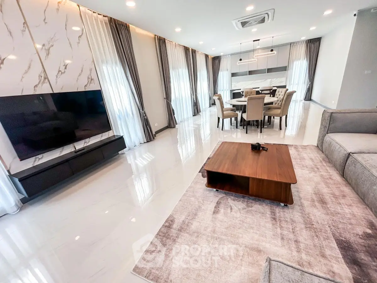 Luxurious modern living room with elegant dining area and marble accents