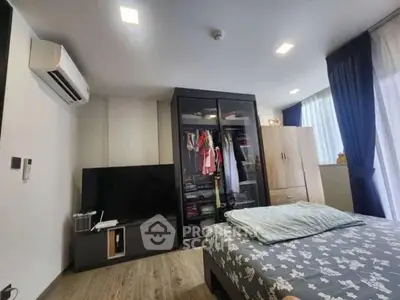 Modern bedroom with stylish wardrobe and air conditioning