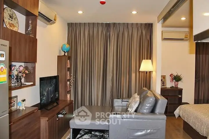 Modern living room with stylish furniture and cozy ambiance in a contemporary apartment.