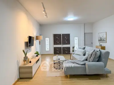 Spacious modern living room with stylish decor and comfortable seating