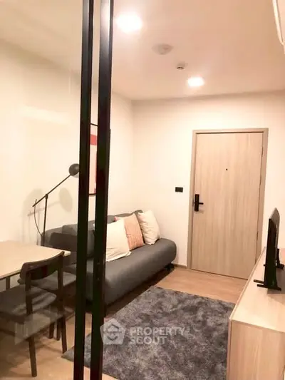 Cozy modern living room with stylish furniture and warm lighting, perfect for relaxation and entertainment.