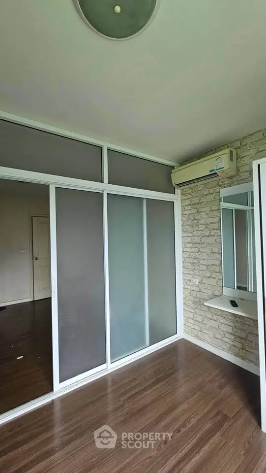 Modern interior with sliding glass doors and air conditioning in a stylish room.
