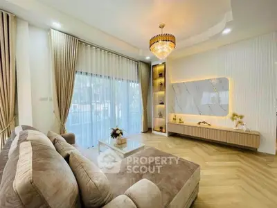 Luxurious living room with elegant chandelier and modern decor