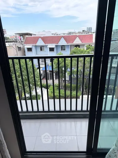 Charming balcony with city view, perfect for relaxation and enjoying the urban landscape.