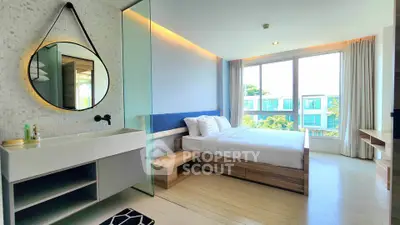Modern bedroom with large window and stylish decor in a luxury apartment.
