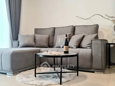 Stylish modern living room with gray sofa and chic decor