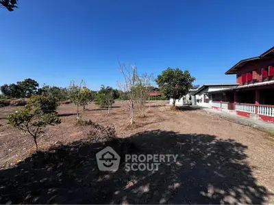 Expansive rural property with clear blue skies and potential for development.