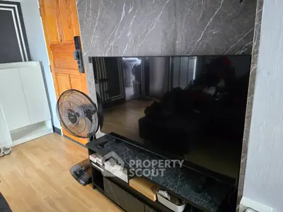 Modern living room with sleek TV setup and stylish decor