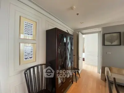 Elegant living room with stylish furniture and wall art in a modern apartment.