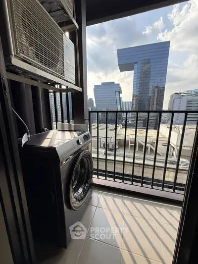Modern balcony with washer and city skyscraper view, perfect for urban living.
