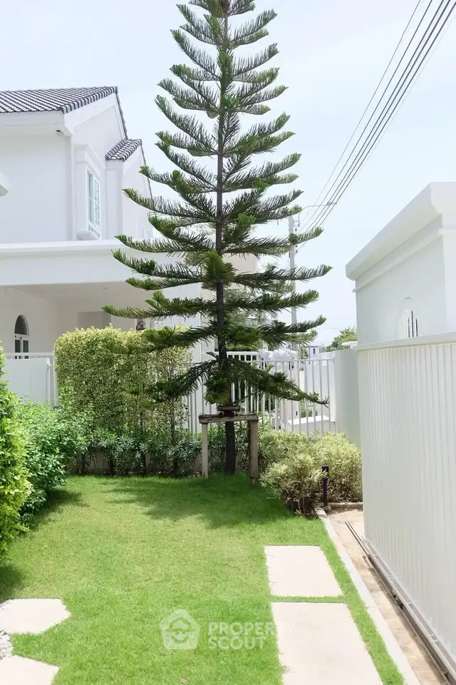Charming suburban home with lush garden and modern exterior design.