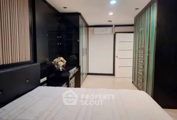 Luxurious bedroom with elegant cabinetry and modern decor