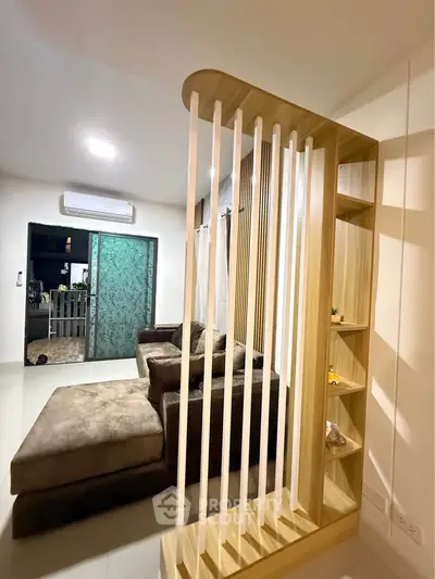 Modern living room with stylish partition and cozy seating area