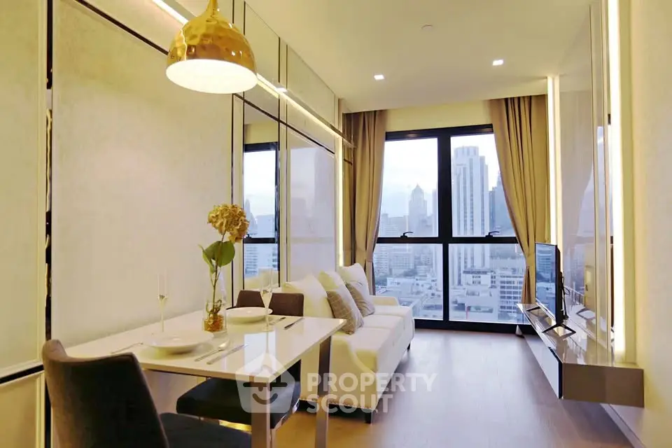 Modern living room with city view, elegant decor, and cozy seating area in a high-rise apartment.