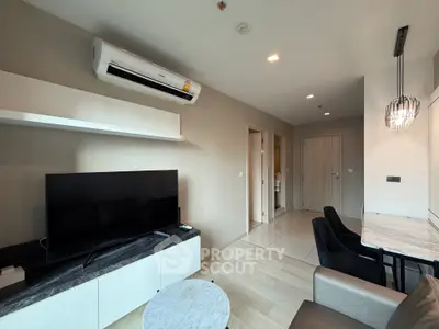 Modern living room with sleek furniture and air conditioning in a stylish apartment.