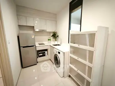 Modern kitchen with sleek appliances and ample storage space