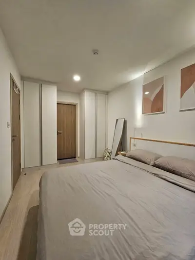 Modern bedroom with minimalist design and cozy ambiance