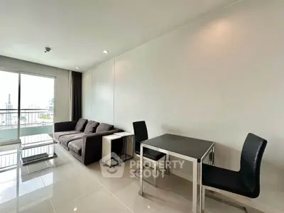 Modern living room with sleek furniture and city view from large window