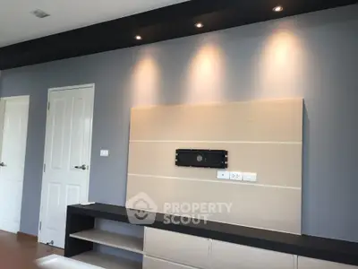 Modern interior with sleek wall design and built-in shelving, perfect for stylish living room setup.