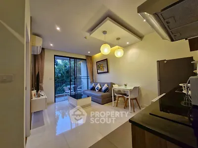 Modern living room with open kitchen and balcony view, featuring stylish decor and contemporary lighting.
