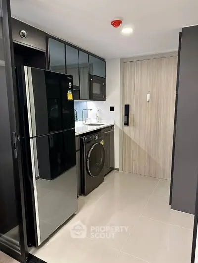 Modern kitchen with sleek appliances and stylish cabinetry