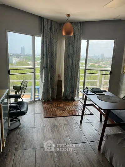 Charming corner unit with panoramic city views and stylish interior design, perfect for modern living.