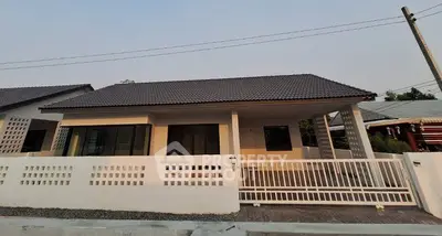 Charming single-story house with modern design and spacious front yard
