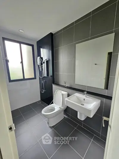 Modern bathroom with sleek design and large window for natural light