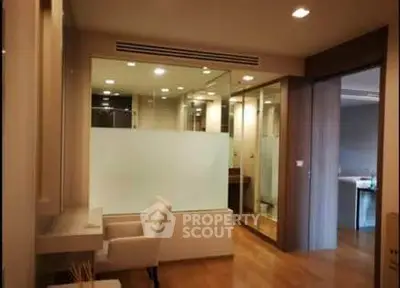Modern interior with glass partition and elegant lighting in a stylish apartment.