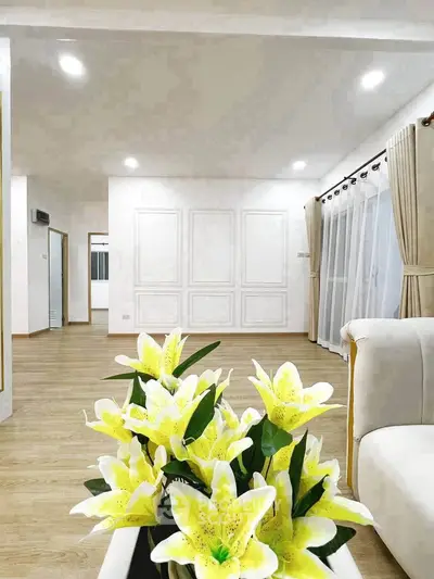 Spacious living room with elegant decor and large windows for natural light.