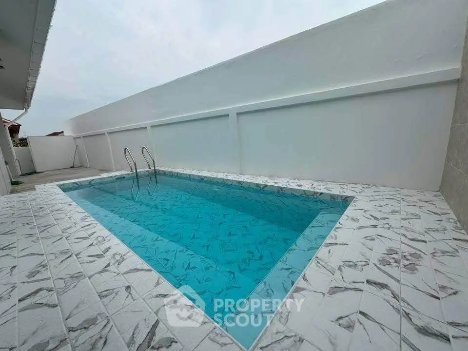 Stunning private pool with elegant tile design in modern property