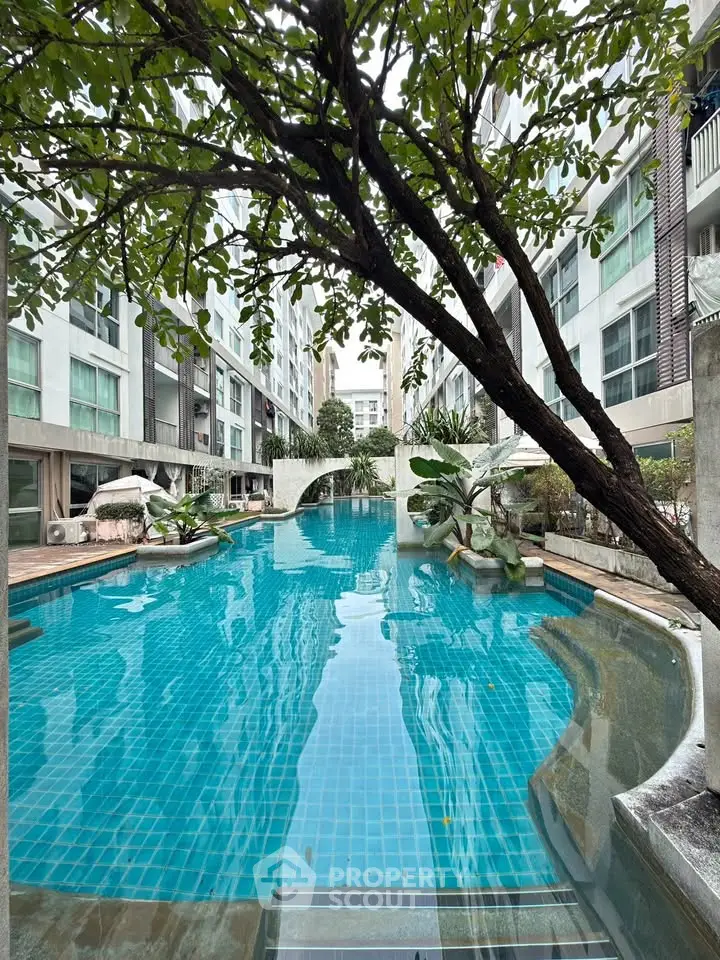 Luxurious residential pool area with modern architecture and lush greenery
