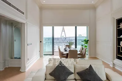 Luxurious living room with elegant dining area and stunning balcony view