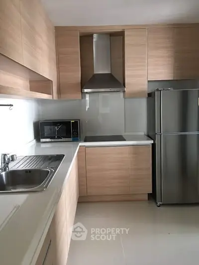 Modern kitchen with sleek cabinetry and stainless steel appliances