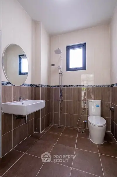 Modern bathroom with sleek tiles and contemporary fixtures