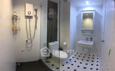 Modern bathroom with glass shower and sleek fixtures