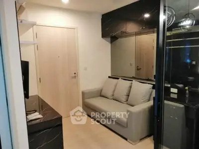 Modern living room with sleek design and comfortable sofa in a stylish apartment.