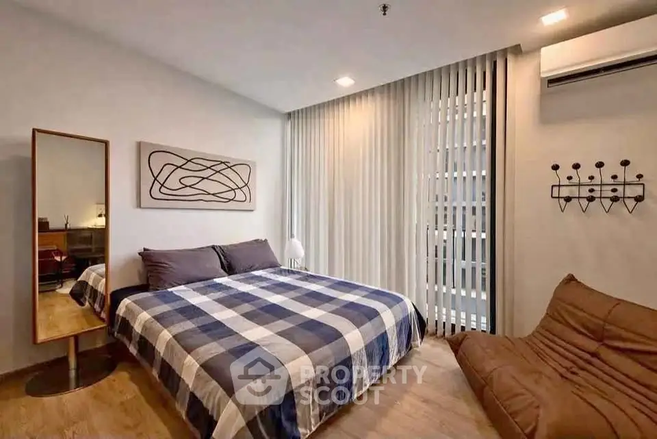 Modern bedroom with stylish decor and natural light