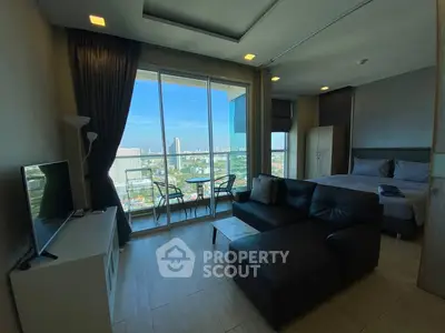 Modern studio apartment with stunning city view and cozy living area